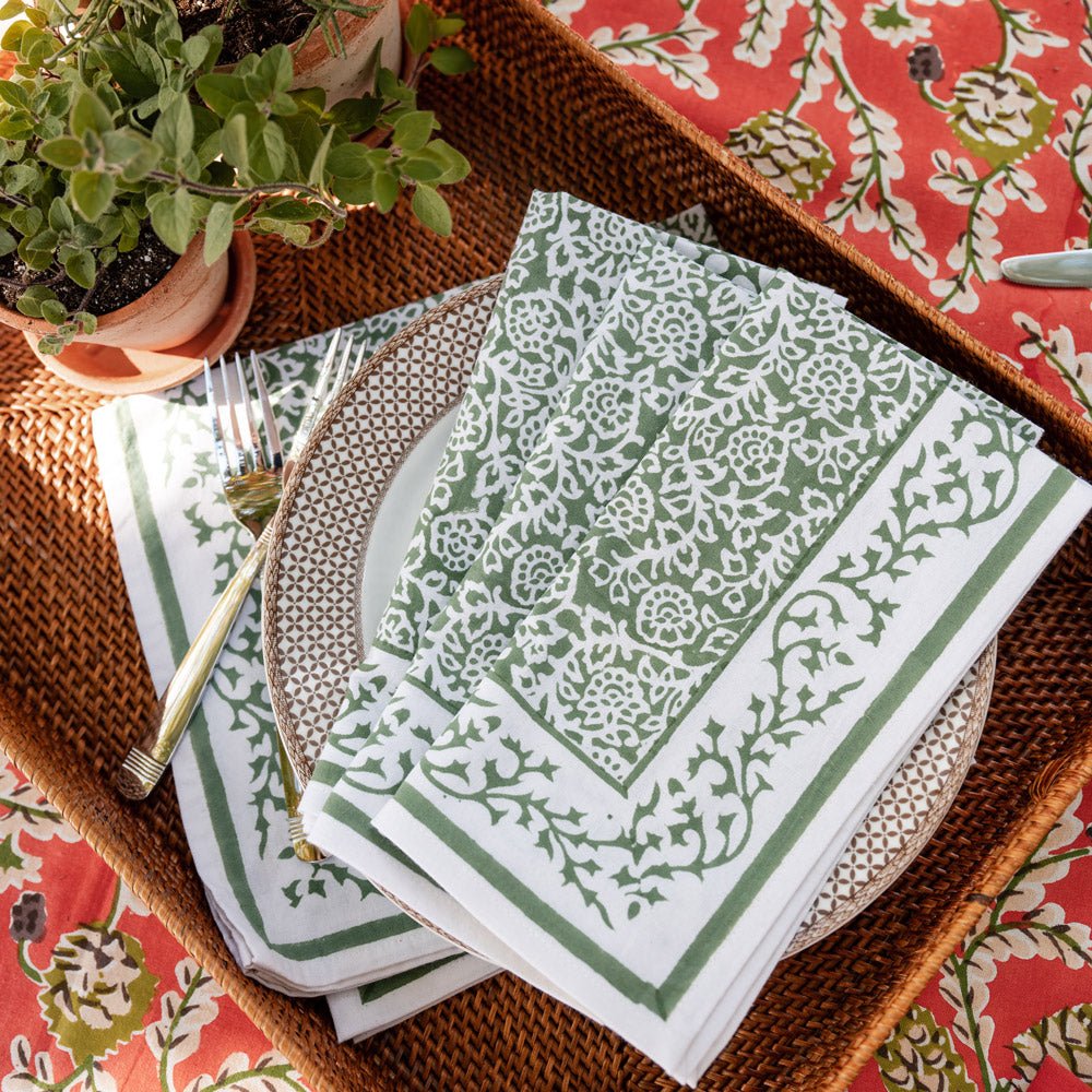 tapestry green napkins on brown and white plate