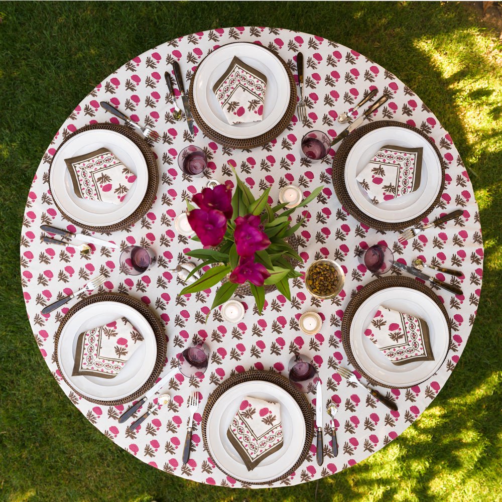 Gaya Fuchsia Pink and Brown Floral tablecloth on round table outdoors