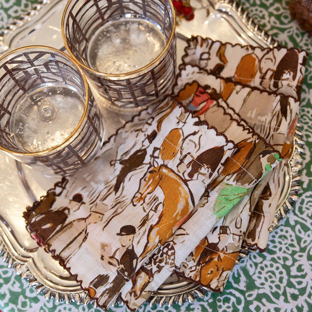 paddock scene cocktail napkins on silver tray with brown bamboo bourbon glasses