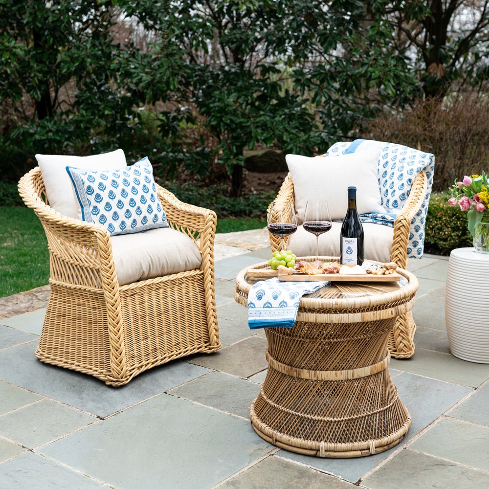 Outdoor seating with Pinot Blue &amp; White Floral Hand Block Printed throw pillow and quilt