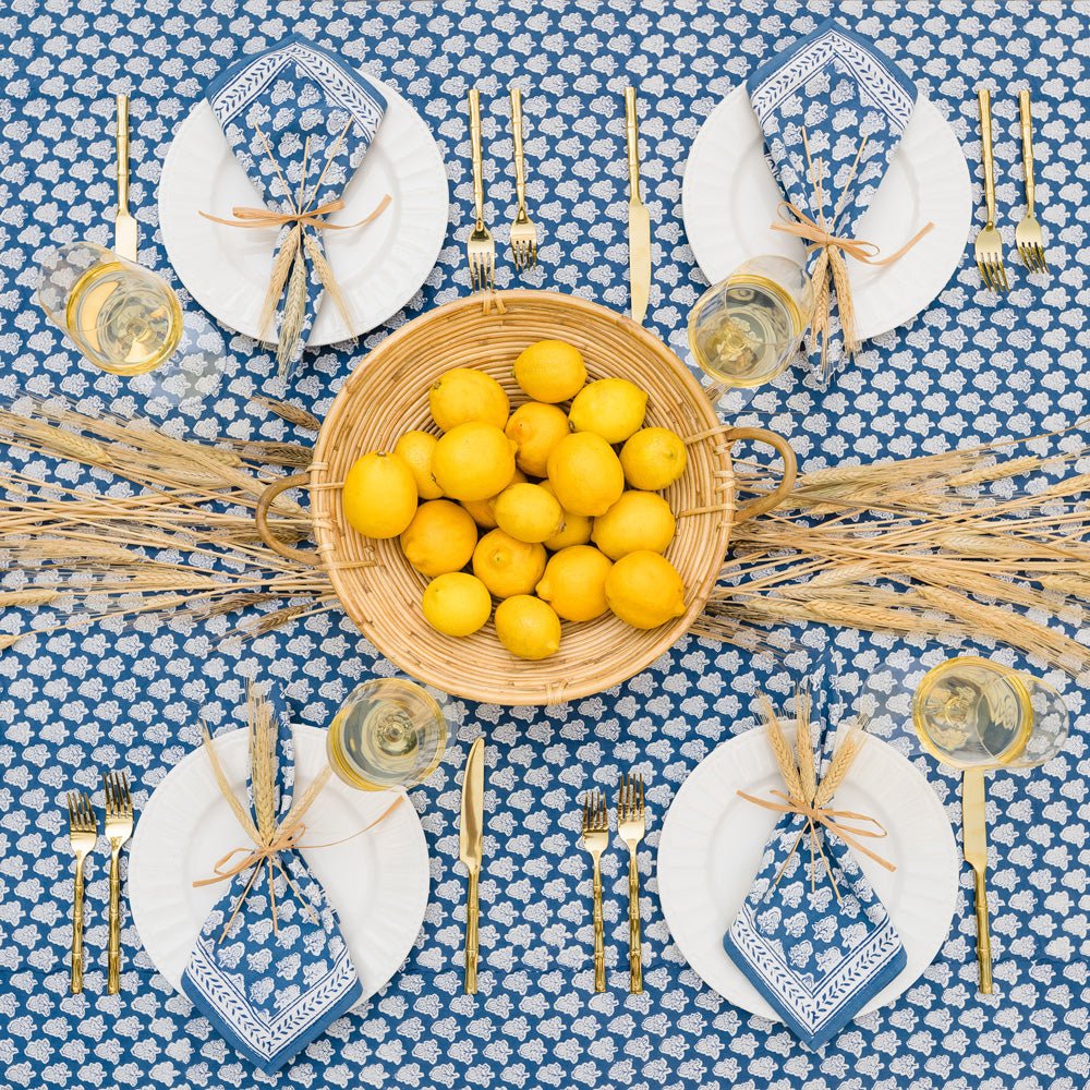 overhead view of table with pom buti denim tablecloth and matching napkins