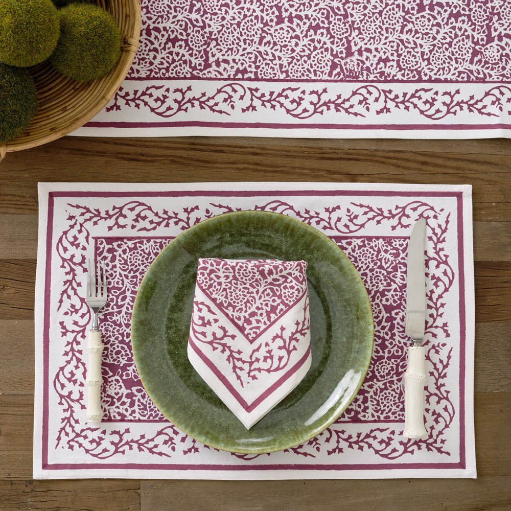Tapestry eggplant purple &amp; white napkin on green plate and matching placemat