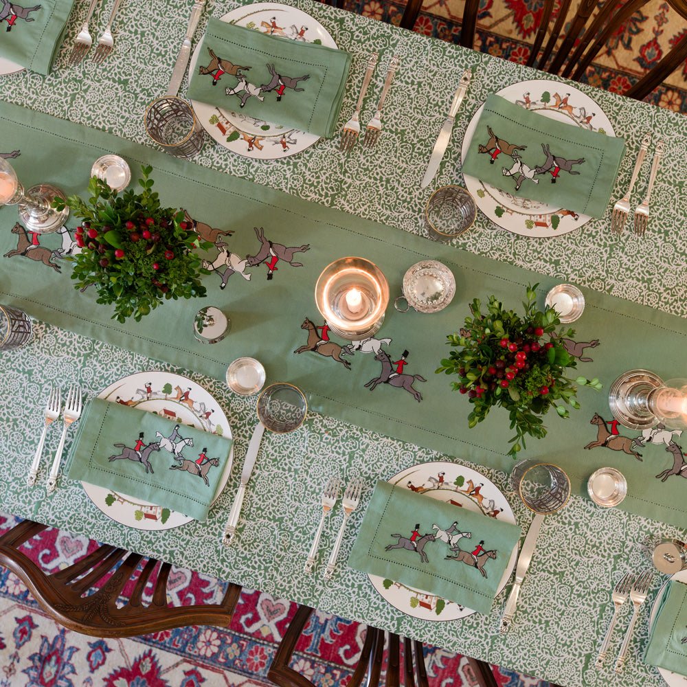 Embroidered Hunt Green table runner and matching napkins on tapestry green tablecloth