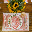 Tapestry Persimmon Placemat with matching napkin on table with sunflowers