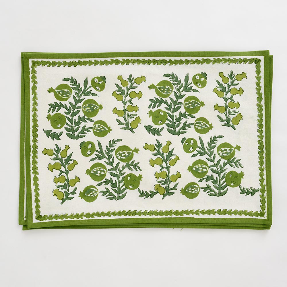 Pom Bells Green Placemat with leaves and pomegranates. 