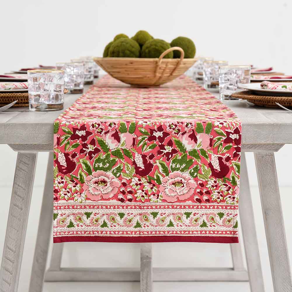 Spice Route Garnet table runner decorating center of table. 