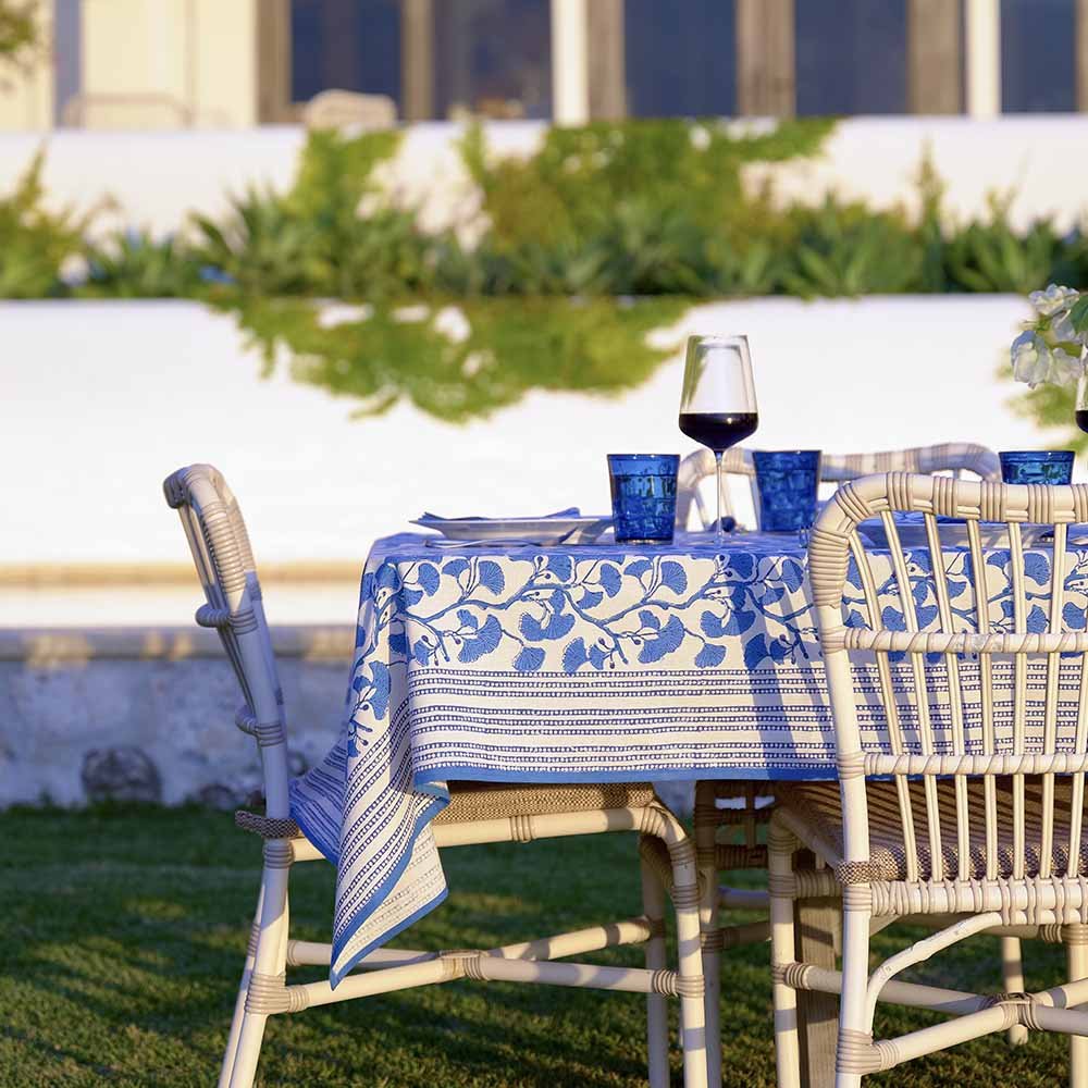 Outdoor shot of dinner table set with Ginkgo Blue textiles. 