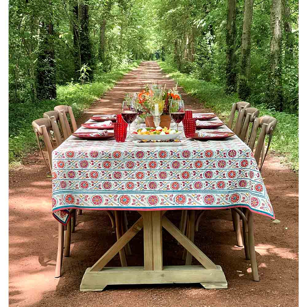 Bukhara Stripe Brick & Teal Tablecloth in wooded setting
