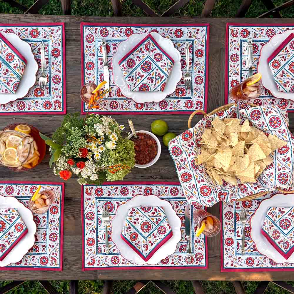 Bukhara Stripe Brick & Teal Placemat on outdoor wooden table