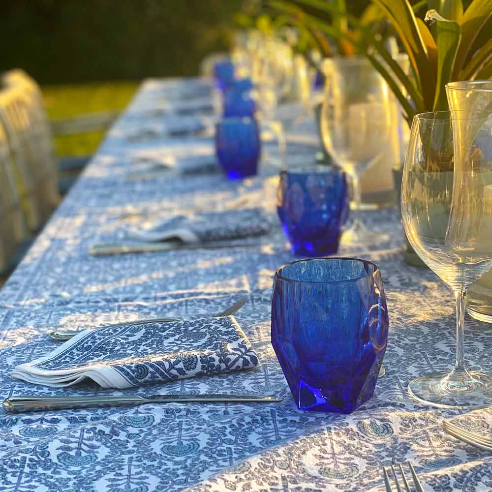 Caroline Blue Tablecloth with blue glasses.