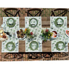 Outdoor dinner table with placemats, napkins, and table runner. 