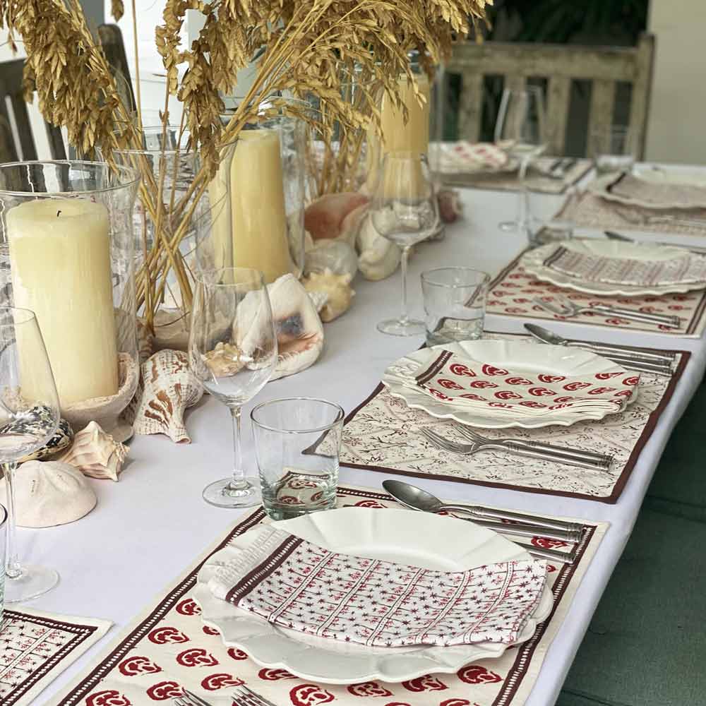 India Hicks Carnations Napkin with candles and centerpiece