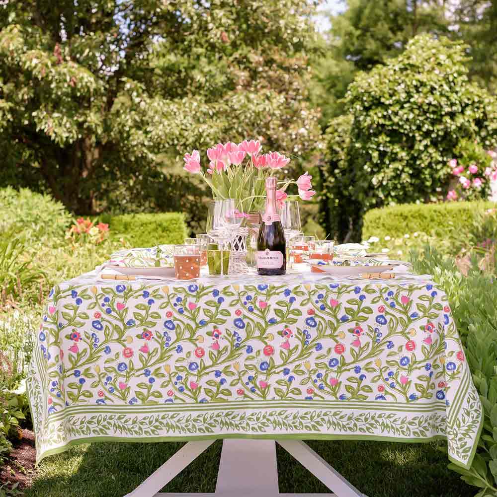 Green, blue, pink, and yellow floral printed tablecloth.