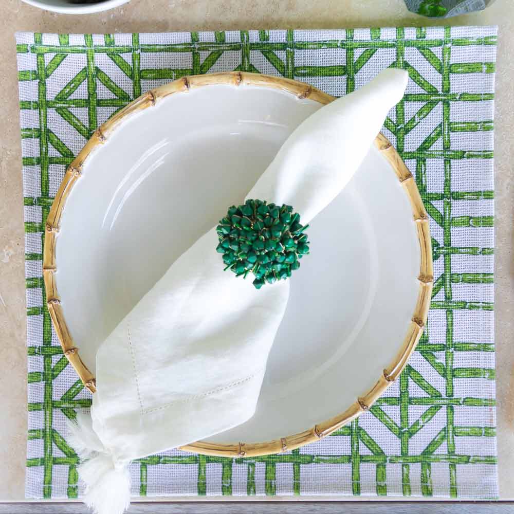 Green Bamboo Square Jute Placemat with plate and napkin.