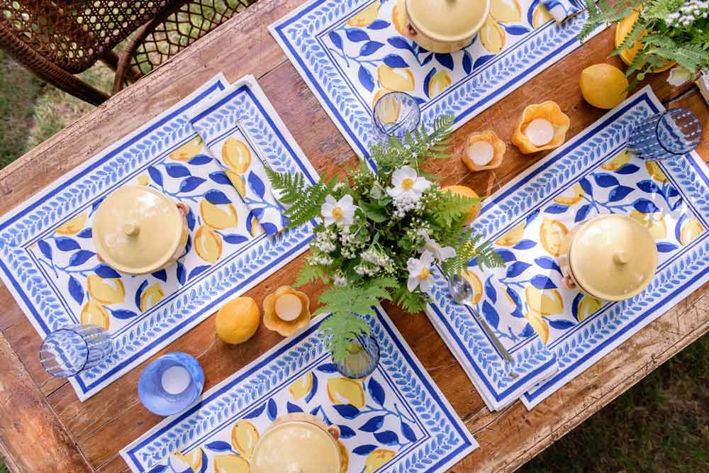 Table with lemon and navy placemats.