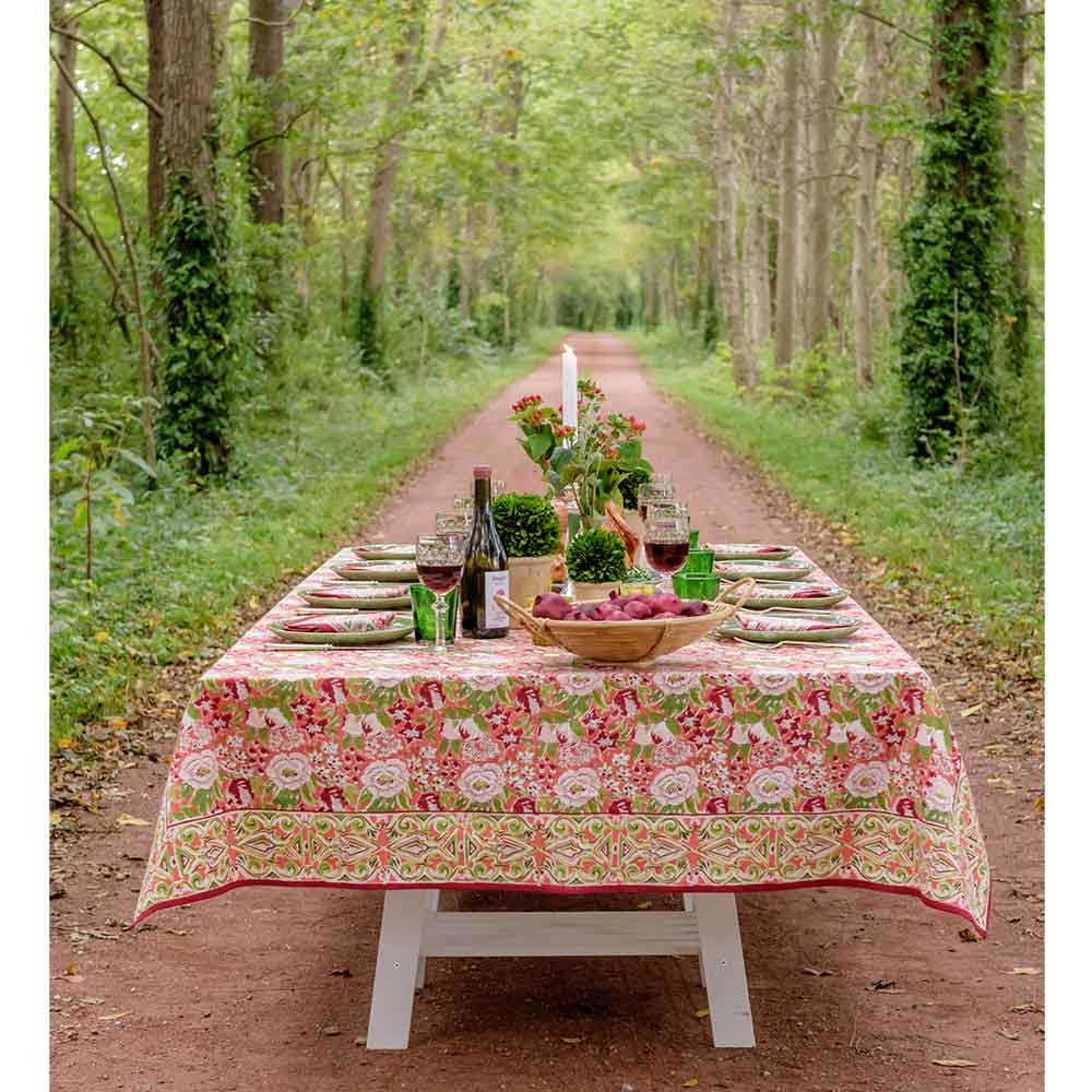 Spice Route Garnet Tablecloth on table set in the woods.