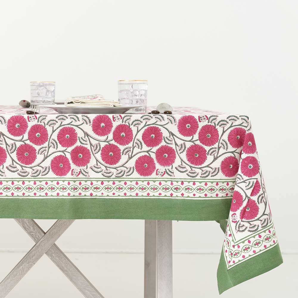 Beautiful floral detailed tablecloth with green border. 